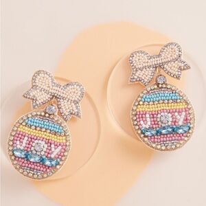 956. Joy bow Easter post beaded earrings